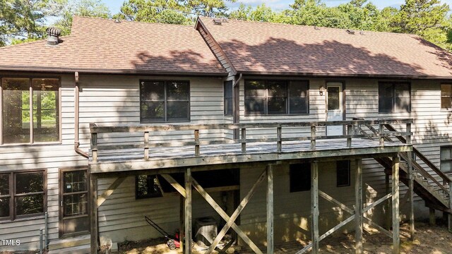 5900 Ebenezer Church Rd, Raleigh, NC 27612 - rear view of property featuring a shingled roof, a wooden deck, and stairway