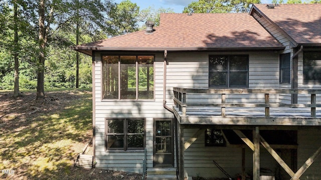 5900 Ebenezer Church Rd, Raleigh, NC 27612 - rear view of house featuring roof with shingles and a deck