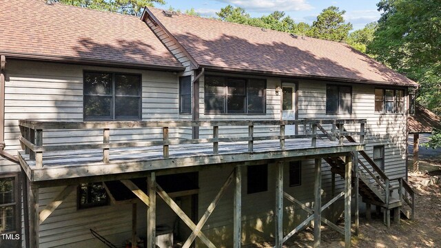 5900 Ebenezer Church Rd, Raleigh, NC 27612 - rear view of house with a shingled roof, a wooden deck, and stairway