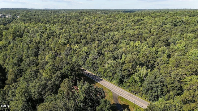 5900 Ebenezer Church Rd, Raleigh, NC 27612 - aerial view of property and surrounding area with a heavily wooded area
