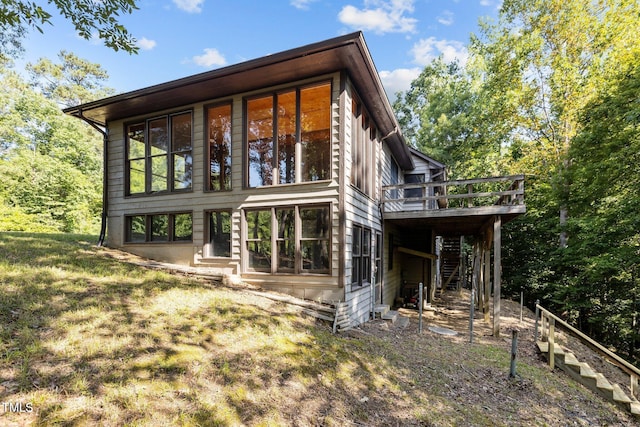 5900 Ebenezer Church Rd, Raleigh, NC 27612 - rear view of property with stairway and a deck