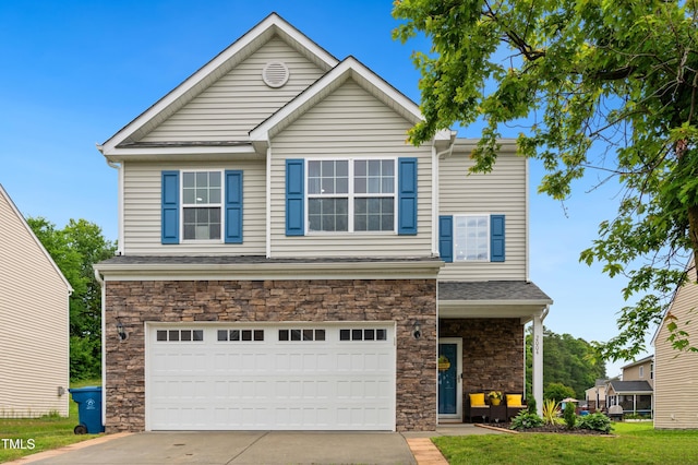 2004 Tennessee Rd, Durham, NC 27704 - view of front facade with stone siding, an attached garage, and driveway