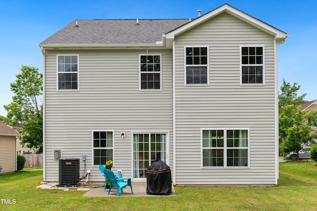 2004 Tennessee Rd, Durham, NC 27704 - rear view of house featuring central AC unit, a patio area, and a yard