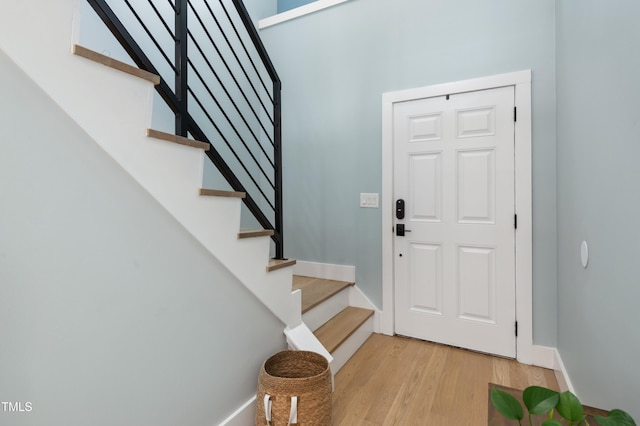2004 Tennessee Rd, Durham, NC 27704 - foyer featuring light wood finished floors, stairway, and baseboards