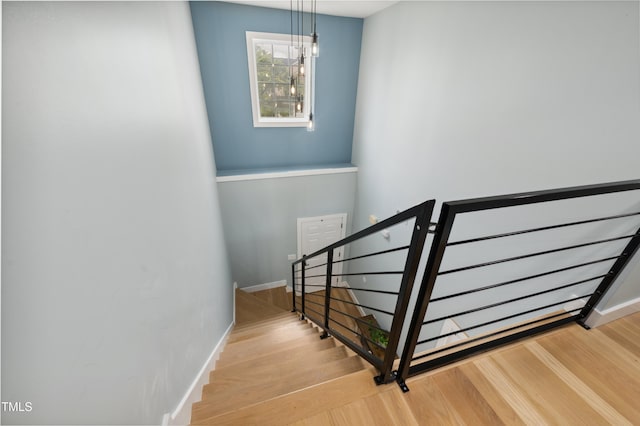 2004 Tennessee Rd, Durham, NC 27704 - stairs featuring wood finished floors, a chandelier, and baseboards