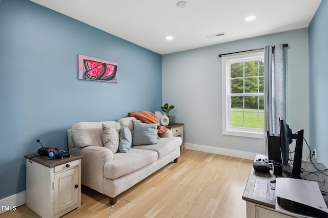 2004 Tennessee Rd, Durham, NC 27704 - living room featuring light wood-style flooring, baseboards, and recessed lighting