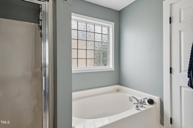 2004 Tennessee Rd, Durham, NC 27704 - bathroom featuring a bath and a shower stall