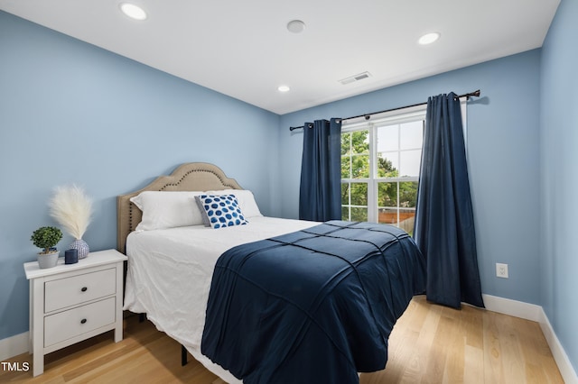 2004 Tennessee Rd, Durham, NC 27704 - bedroom featuring light wood-style floors, baseboards, and recessed lighting