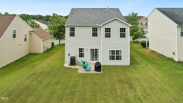 2004 Tennessee Rd, Durham, NC 27704 - back of house featuring a patio, a lawn, cooling unit, and roof with shingles
