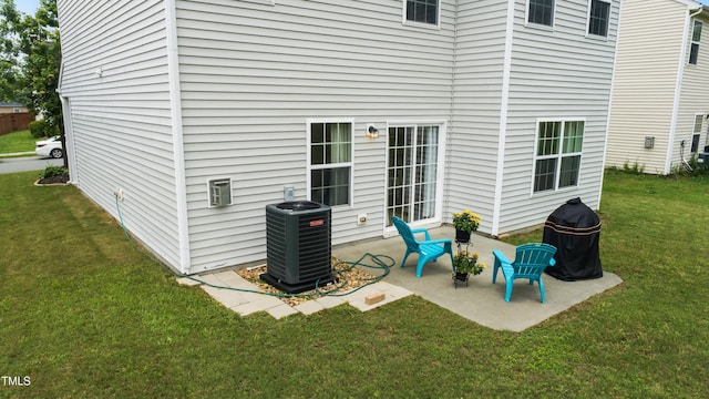 2004 Tennessee Rd, Durham, NC 27704 - back of property featuring cooling unit, a patio, and a yard
