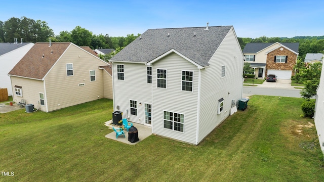 2004 Tennessee Rd, Durham, NC 27704 - rear view of property featuring central AC unit, a yard, and an outdoor fire pit
