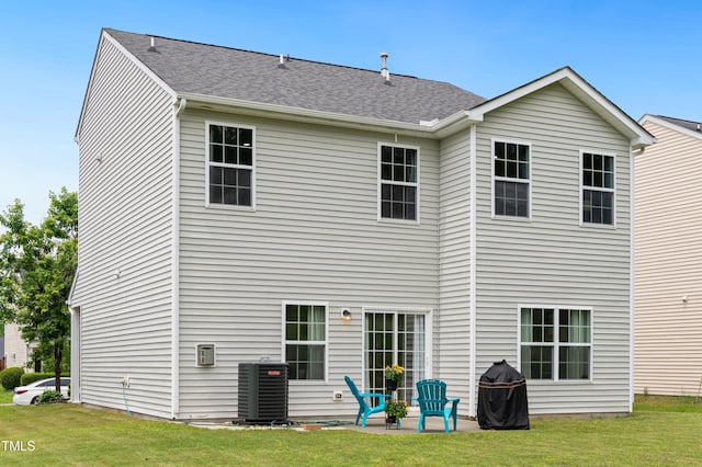 2004 Tennessee Rd, Durham, NC 27704 - back of property with central AC, a lawn, and a patio area