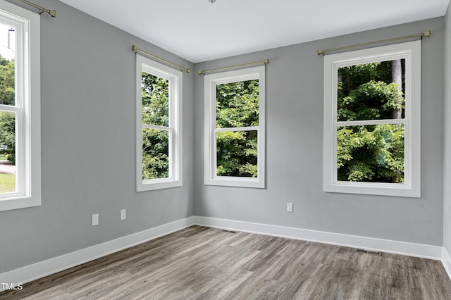 1003 E Sterlington Pl, Apex, NC 27502 - unfurnished room with wood finished floors and baseboards