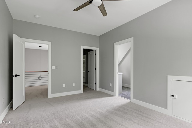 1003 E Sterlington Pl, Apex, NC 27502 - unfurnished bedroom featuring carpet floors, a spacious closet, baseboards, and ensuite bath