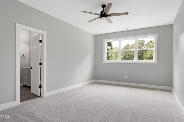 1003 E Sterlington Pl, Apex, NC 27502 - spare room featuring carpet, ceiling fan, and baseboards