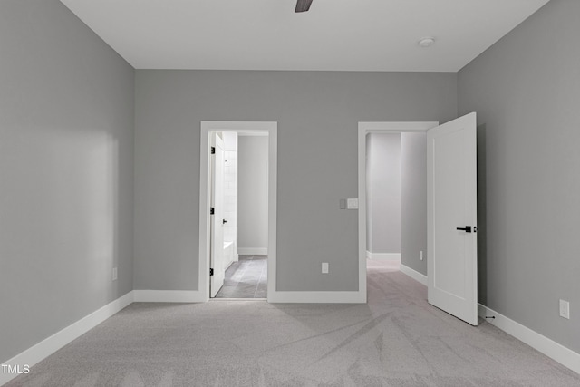1003 E Sterlington Pl, Apex, NC 27502 - unfurnished bedroom featuring light colored carpet, baseboards, and ceiling fan