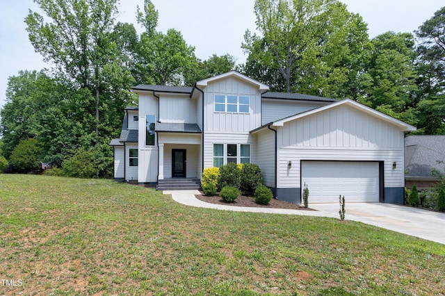 1003 E Sterlington Pl, Apex, NC 27502 - view of front of home with a garage, driveway, board and batten siding, and a front yard