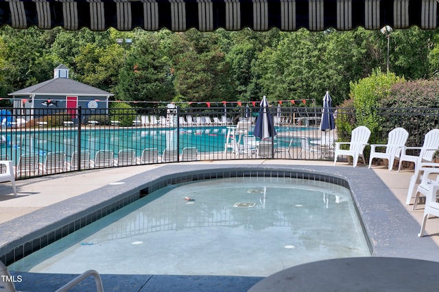 1003 E Sterlington Pl, Apex, NC 27502 - community pool featuring a patio area