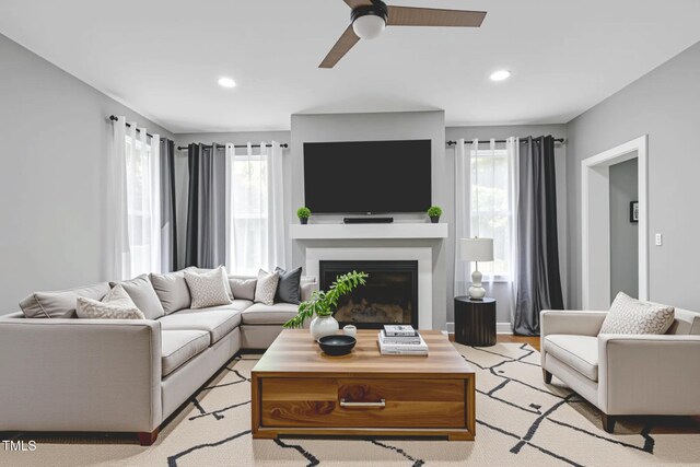 1003 E Sterlington Pl, Apex, NC 27502 - living room with ceiling fan, a fireplace, recessed lighting, and light wood-style flooring