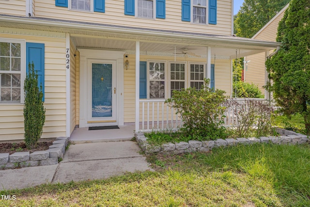 view of exterior entry with covered porch