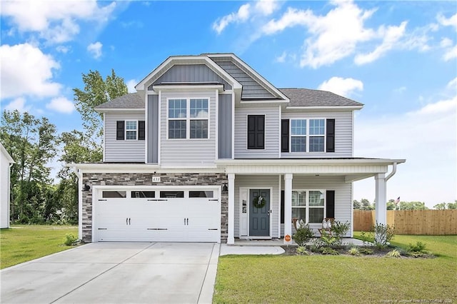 633 Amusement Dr, Hope Mills, NC 28348 - view of front of home featuring driveway, a garage, and a porch