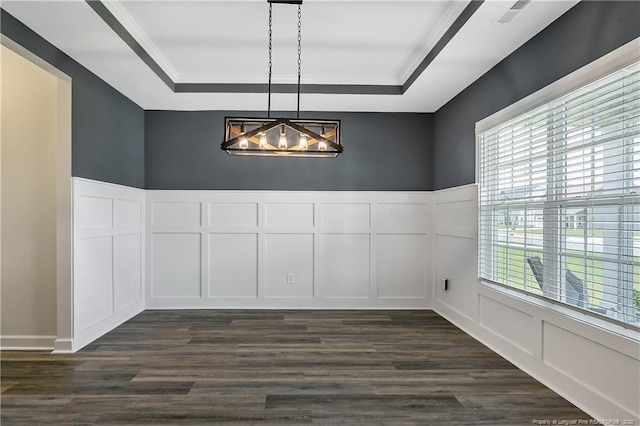 633 Amusement Dr, Hope Mills, NC 28348 - unfurnished room with a decorative wall, a tray ceiling, a chandelier, plenty of natural light, and dark wood finished floors