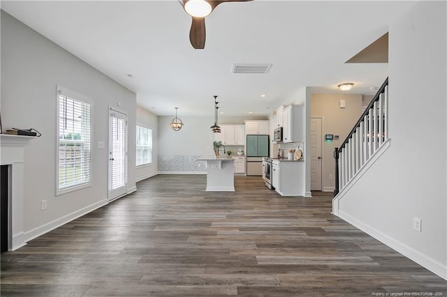 633 Amusement Dr, Hope Mills, NC 28348 - living room with a ceiling fan, baseboards, dark wood-type flooring, and recessed lighting