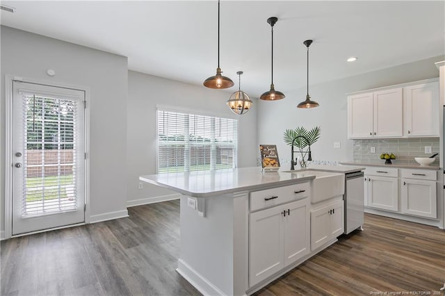 633 Amusement Dr, Hope Mills, NC 28348 - kitchen featuring a sink, dark wood-type flooring, stainless steel dishwasher, light countertops, and recessed lighting