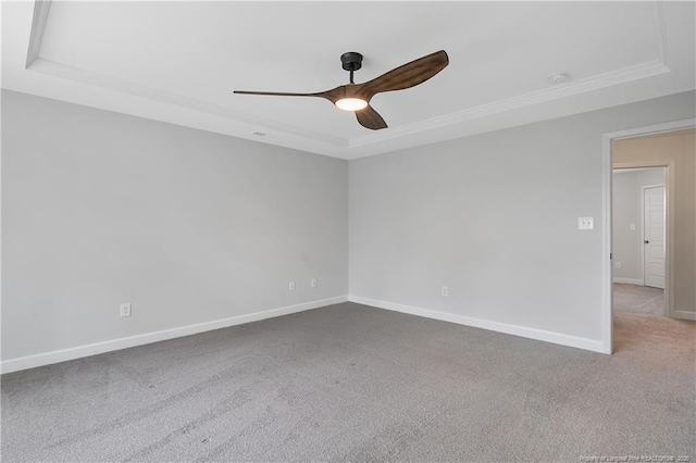 633 Amusement Dr, Hope Mills, NC 28348 - spare room with a tray ceiling, ceiling fan, carpet flooring, baseboards, and crown molding
