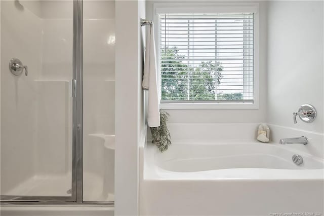 633 Amusement Dr, Hope Mills, NC 28348 - bathroom with a shower stall and a bath