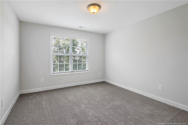 633 Amusement Dr, Hope Mills, NC 28348 - unfurnished room featuring carpet and baseboards