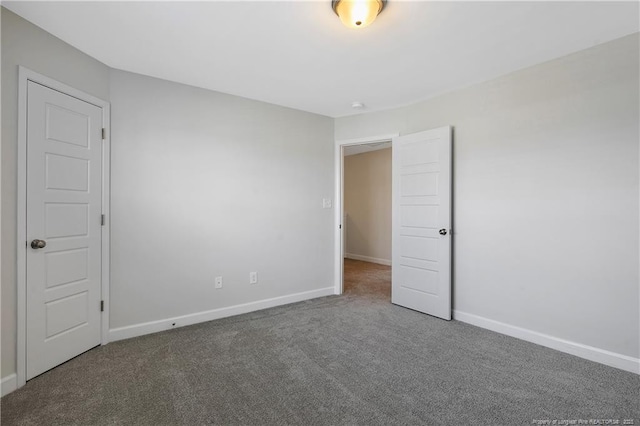 633 Amusement Dr, Hope Mills, NC 28348 - carpeted empty room with baseboards