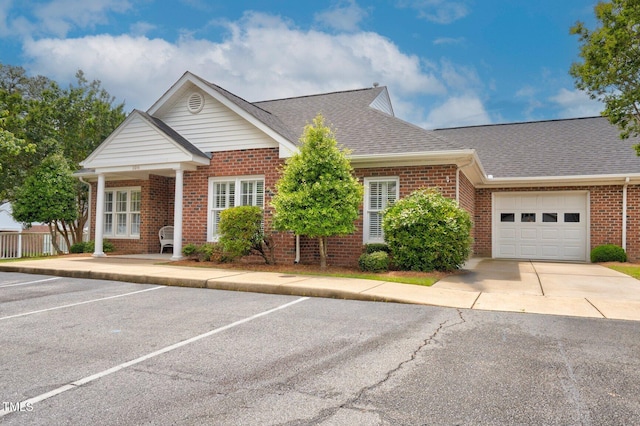 106 Irene Ct, Rocky Mount, NC 27804 - view of front of home featuring brick siding, a shingled roof, and uncovered parking