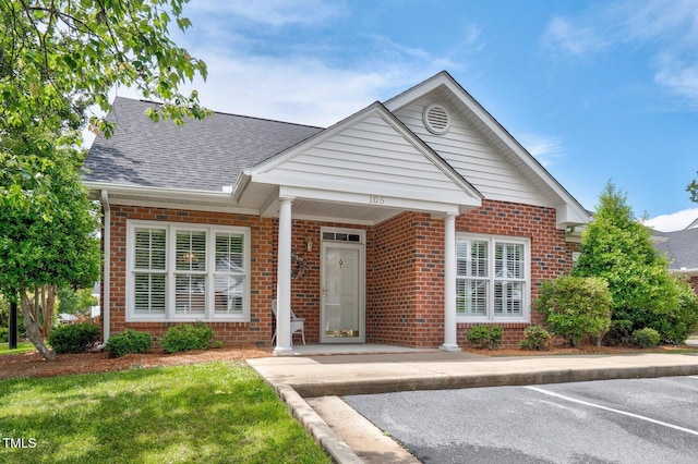 106 Irene Ct, Rocky Mount, NC 27804 - view of front of house featuring brick siding, roof with shingles, and uncovered parking