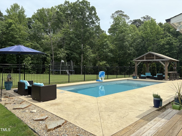 view of swimming pool with an outdoor living space, a gazebo, and a patio area