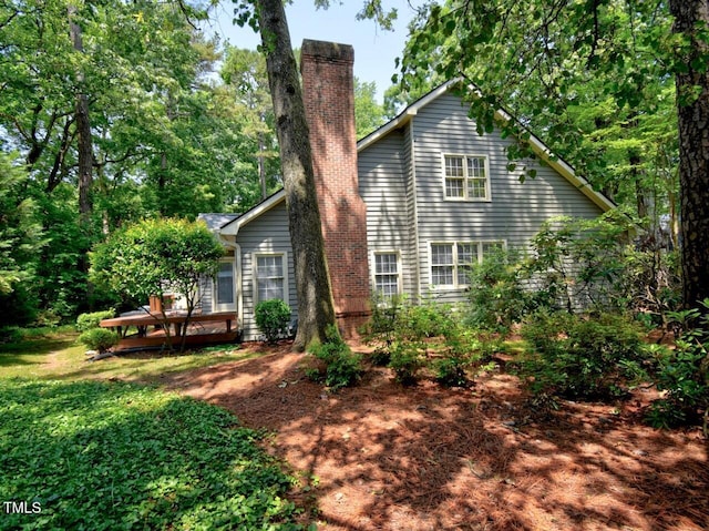 119 Long Shadow Ln, Cary, NC 27518 - rear view of house with a chimney