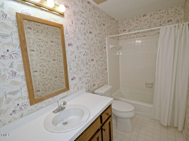 119 Long Shadow Ln, Cary, NC 27518 - bathroom with wallpapered walls, tile patterned floors, vanity, toilet, and shower / tub combo with curtain