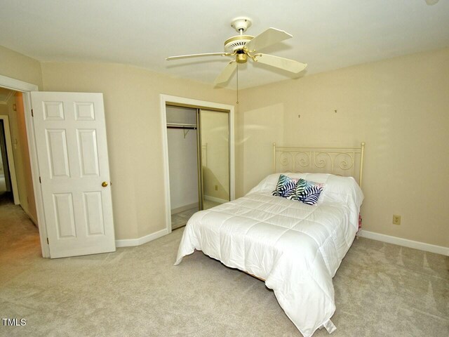 119 Long Shadow Ln, Cary, NC 27518 - bedroom featuring carpet flooring, a closet, a ceiling fan, and baseboards