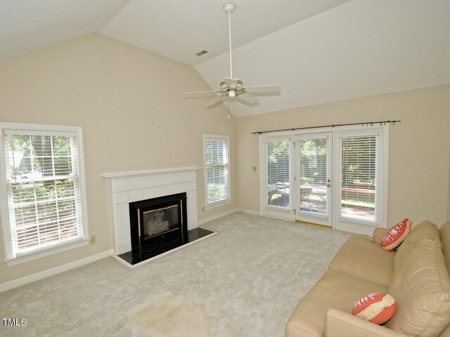119 Long Shadow Ln, Cary, NC 27518 - unfurnished living room with lofted ceiling, a fireplace, a ceiling fan, baseboards, and carpet flooring