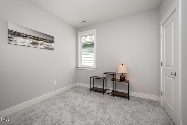 living area with carpet flooring and baseboards