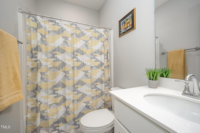 full bathroom with toilet, vanity, and a shower with shower curtain