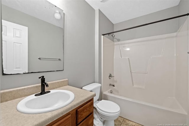 full bath with toilet, vanity,  shower combination, and tile patterned flooring