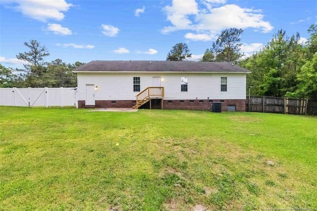 rear view of house featuring crawl space and a gate