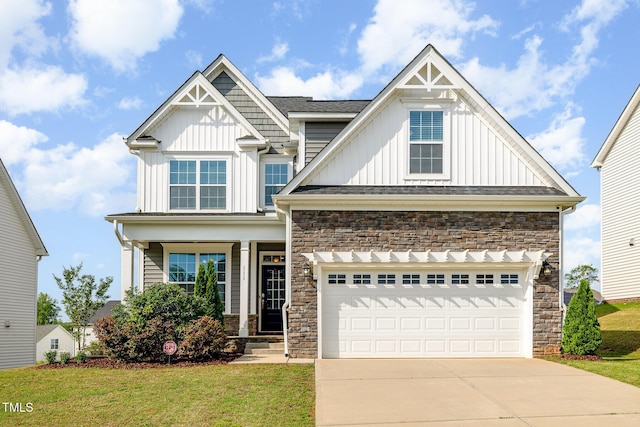 111 Laporte Path, Garner, NC 27529 - craftsman-style house with board and batten siding, driveway, a front yard, stone siding, and a porch
