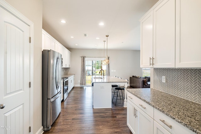111 Laporte Path, Garner, NC 27529 - kitchen with stainless steel appliances, tasteful backsplash, recessed lighting, white cabinets, and dark wood-style floors