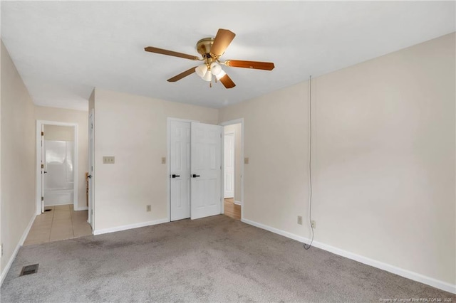 2256 Spindletree Dr, Fayetteville, NC 28304 - unfurnished bedroom featuring carpet flooring, baseboards, a ceiling fan, and ensuite bath