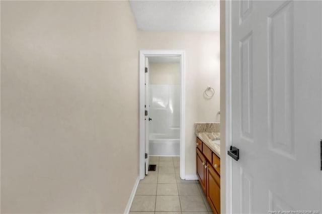 2256 Spindletree Dr, Fayetteville, NC 28304 - bathroom featuring vanity, tile patterned floors, baseboards, a shower, and a tub to relax in