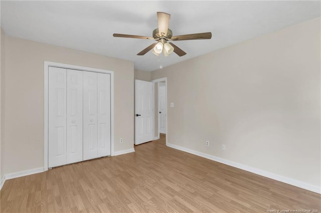 2256 Spindletree Dr, Fayetteville, NC 28304 - unfurnished bedroom featuring baseboards, light wood finished floors, a closet, and a ceiling fan