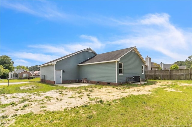 2256 Spindletree Dr, Fayetteville, NC 28304 - back of property with central AC unit, crawl space, and a shingled roof