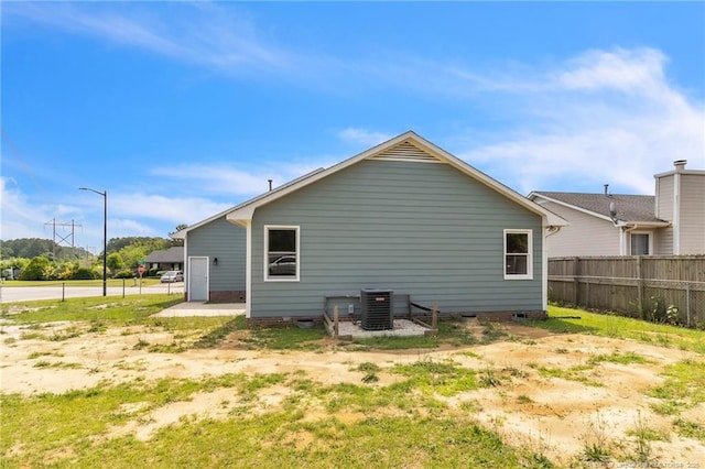 2256 Spindletree Dr, Fayetteville, NC 28304 - back of house with fence, central AC unit, and crawl space